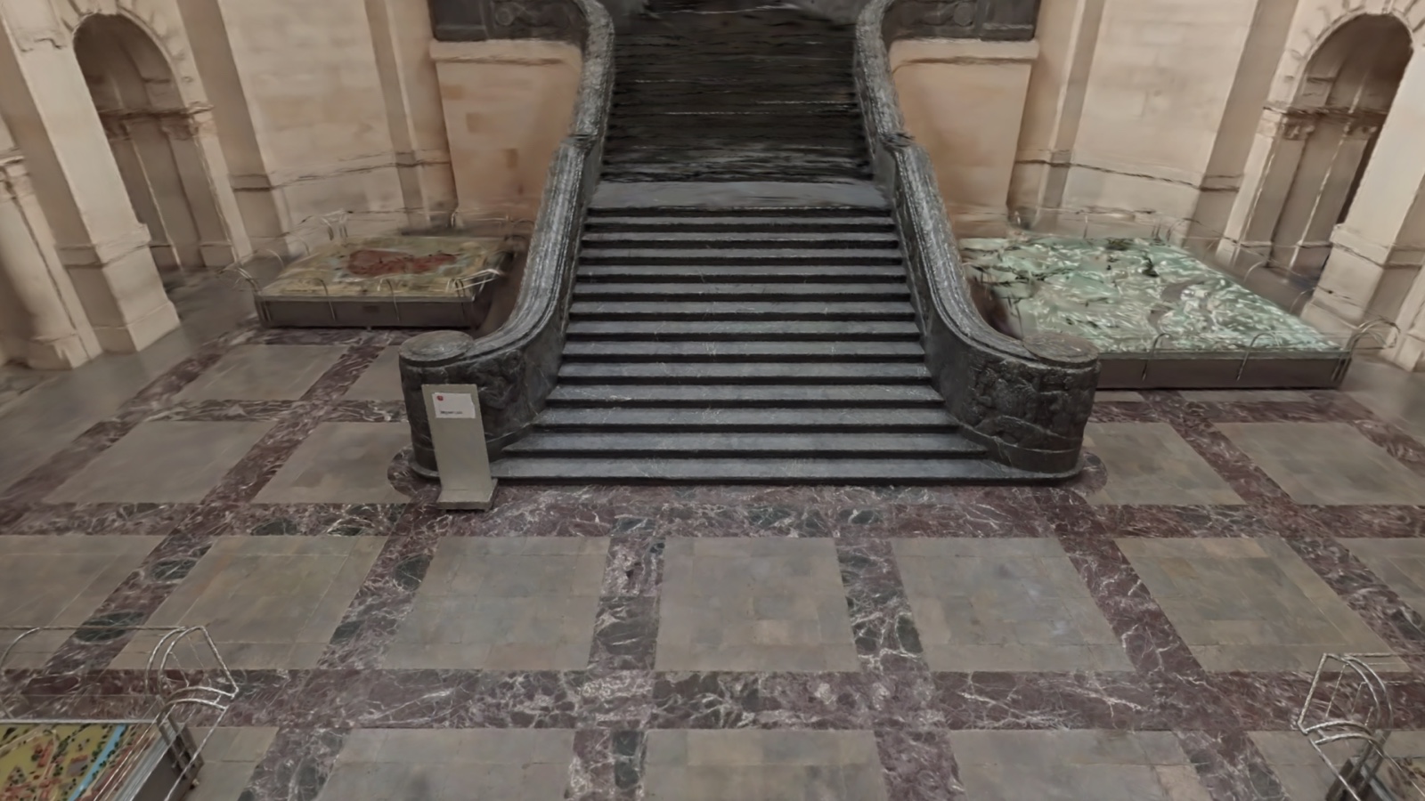 The same real 3D scene, framed from a high overhead angle looking down at the staircase